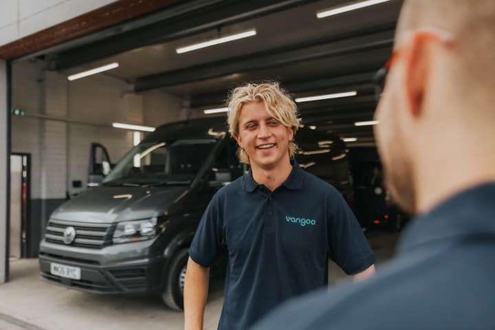 A Vangoo colleague in a workshop beside a commercial van